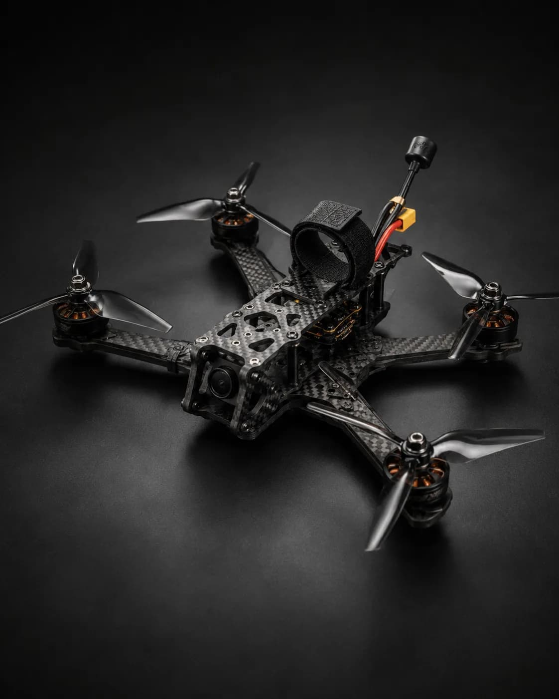 Carbon fibre tactical surveillance drone airframe with folding arms for rapid deployment