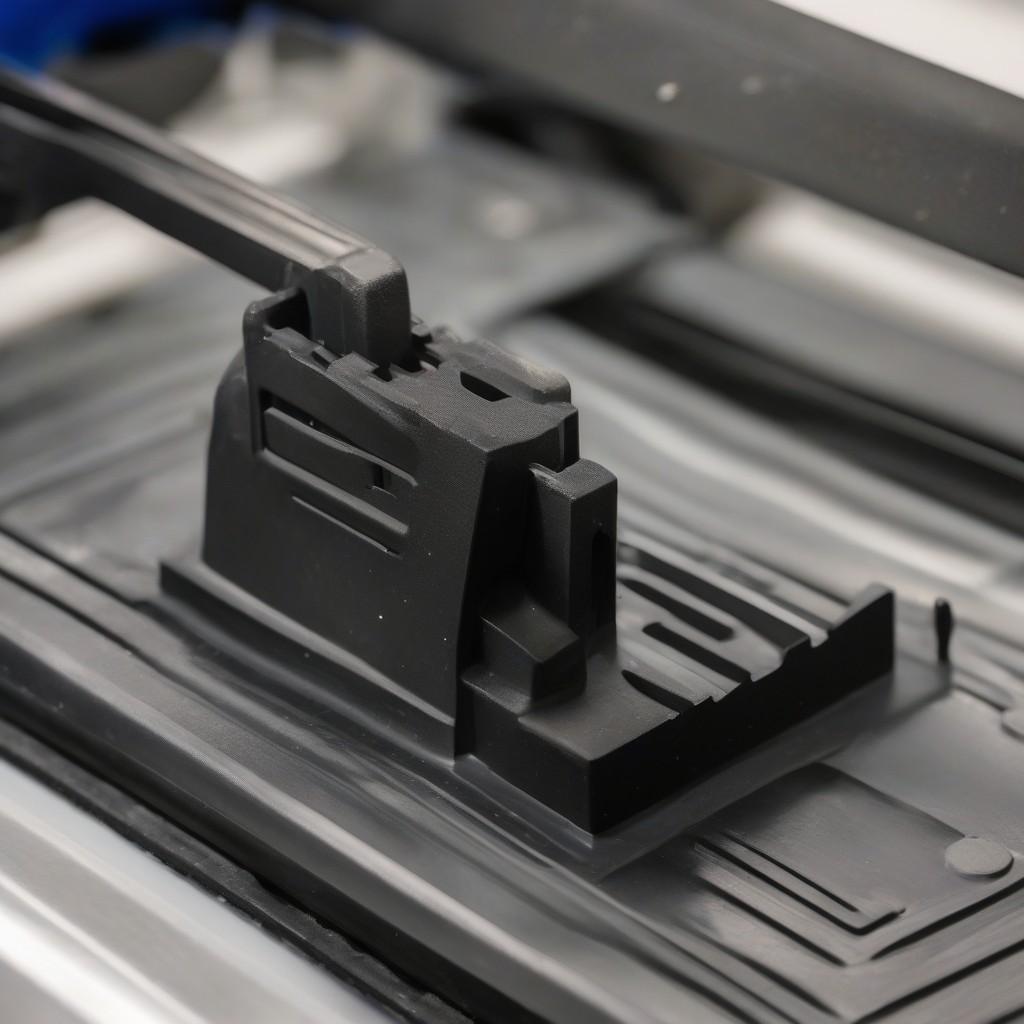 Close-up of a 3D printed injection mold producing a functional automotive duct.